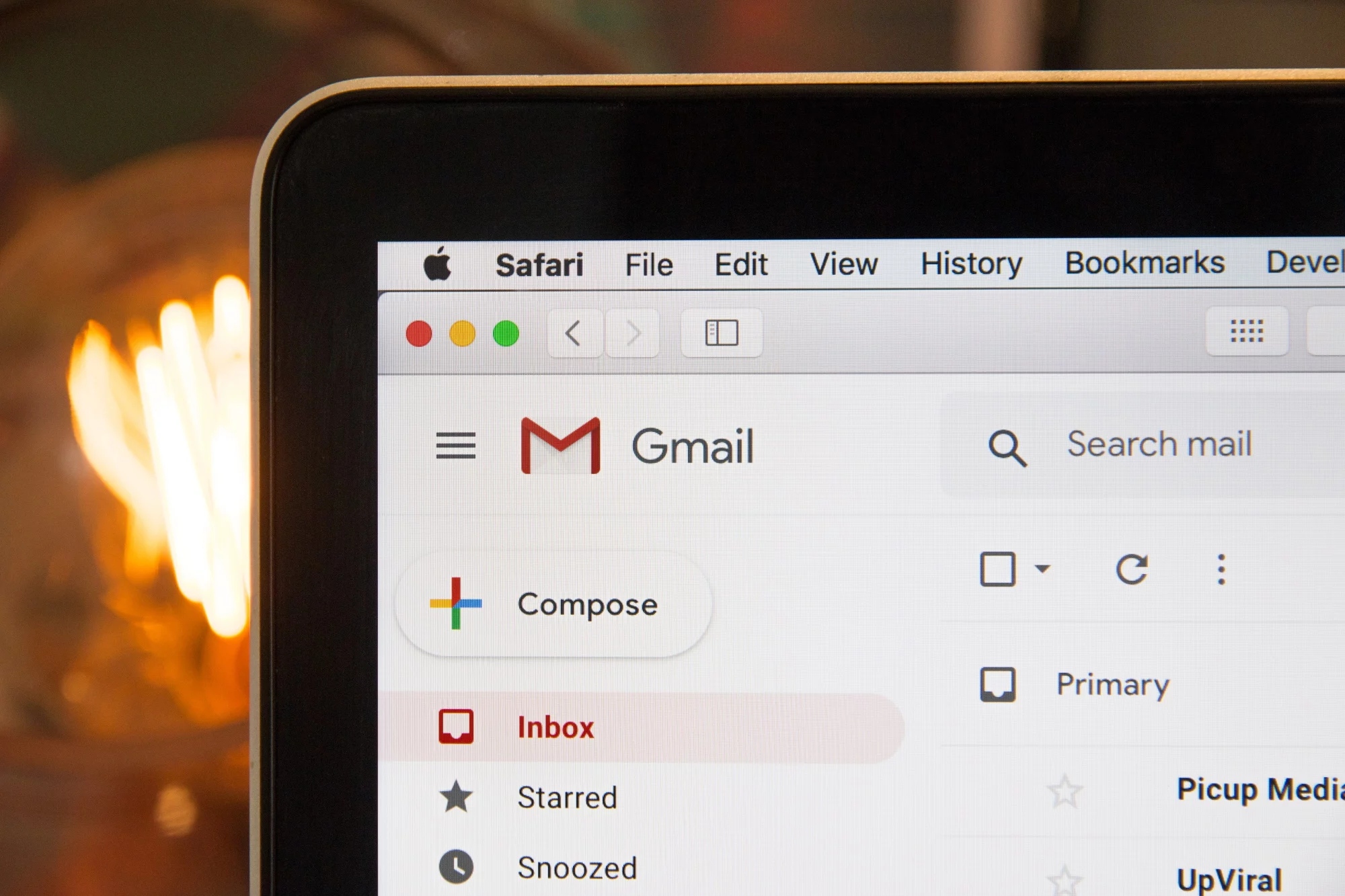 Close up of the corner of laptop screen displaying gmail inbox