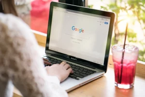 woman using google search on laptop